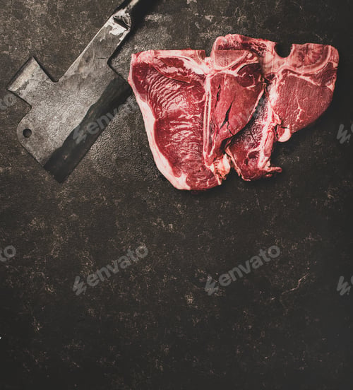 Preview: Fresh uncooked beef meat t-bone steaks and cleaver, copy space