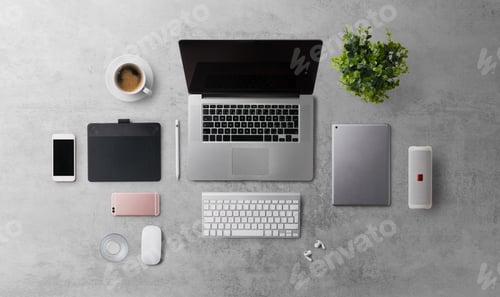 Preview: Flat lay top view office desk working space with laptop and supplies on gray background.