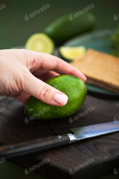 Preview: Fresh avocado on a cutting board ready to cook