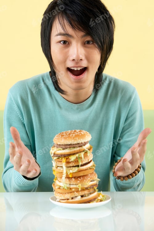 Preview: Teenage Boy Looking At Supersized Hamburger