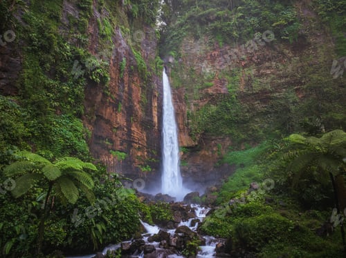Preview: Aerial drone view of Kapas Biru waterfall in deep forest of Lumajang, East Java, Indonesia