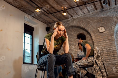 Preview: Portrait of female veteran in PTSD support group.