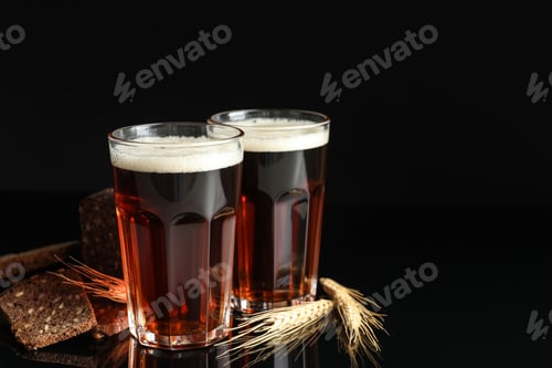 Preview: Delicious kvass, bread and spikes on black background. Space for text