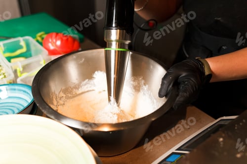 Preview: Chef making cheese mix for cheese pancake at restaurant. Blender whips the cottage cheese.