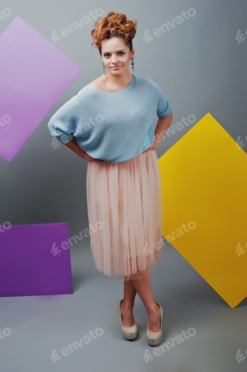 Preview: Full length studio portrait of young girl near art colored blanks.
