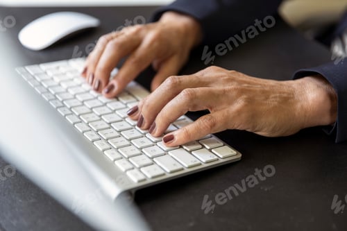 Preview: Woman's hands on computer keyboard, close-up