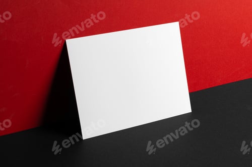 Preview: Blank white business cards on red and black paper background