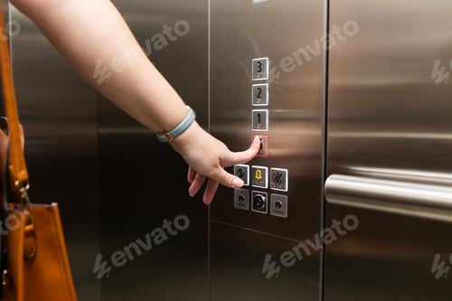 Preview: Pressing elevator button, person with handbag using elevator in office building
