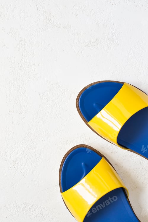 Preview: Female youth bright Yellow blue varnished summer sandals on a white background. Top view