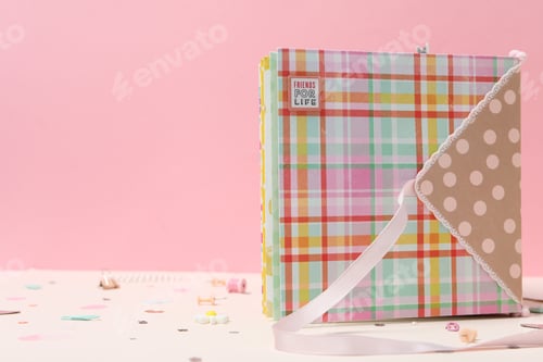 Preview: Scrapbooking, on a pink background, side view.