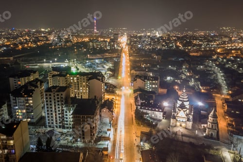 Preview: High rise apartment buildings with illuminated windows in city residential area at night
