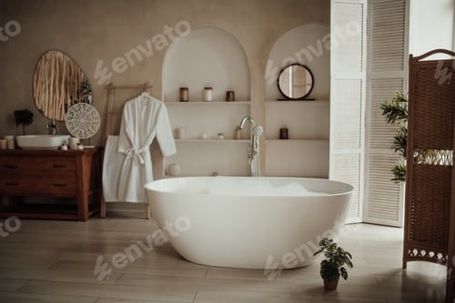 Preview: Luxury interior of big bathroom at modern african style with oval bathtub in natural lighting