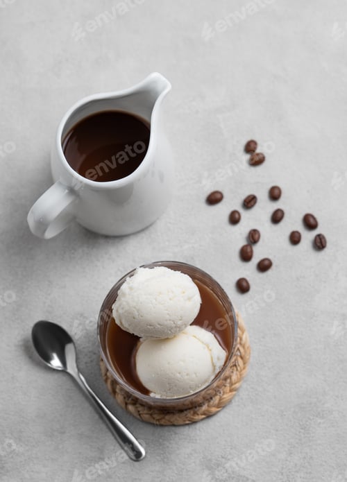 Preview: Affogato coffee with vanilla ice cream scoops and espresso in a glass on a light background