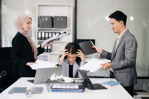 Preview: Stressed Asian Businesswoman Surrounded by Overwhelming Paperwork Concept