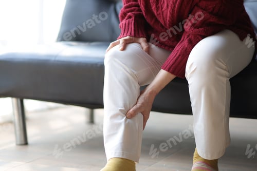 Preview: Senior woman with osteoarthritis has leg pain.