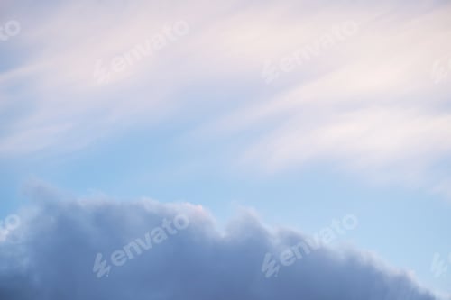 Preview: Soft pastel sky with scattered clouds in the morning light.