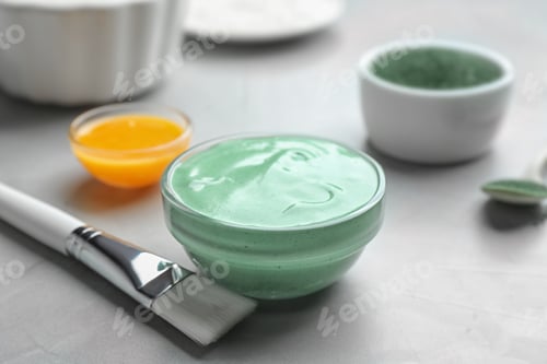 Preview: Freshly made spirulina in bowl and brush on light grey table