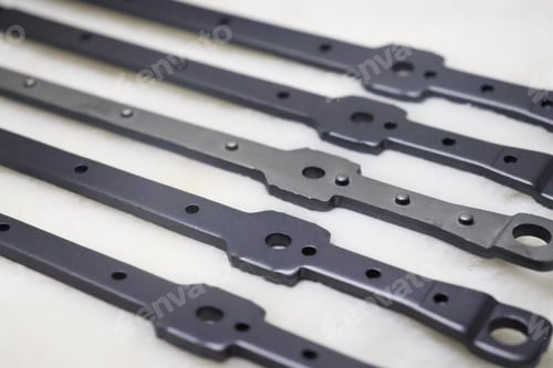 Preview: Selective focus shot of car spare parts on white surface