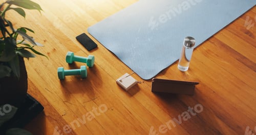 Preview: Gym, equipment and tablet with water on wooden floor for cardio, training and exercise in morning.