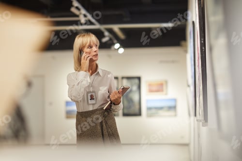 Preview: Mature Woman Managing Art Gallery