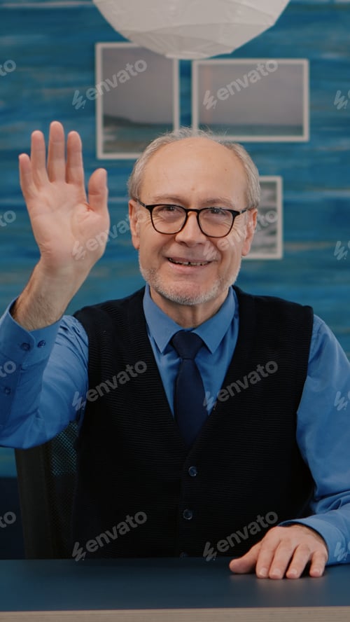 Preview: POV of elderly aged man waving during a video conference