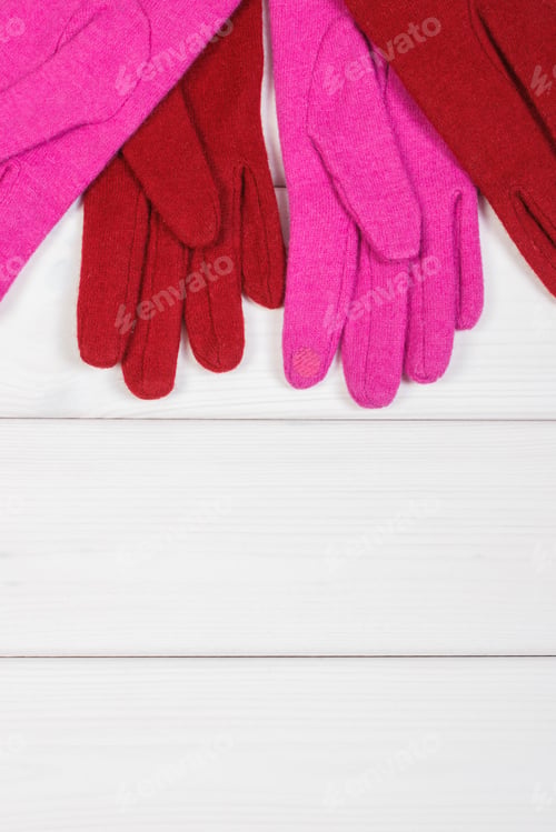 Preview: Colorful womanly gloves on boards, clothing for autumn or winter, copy space for text