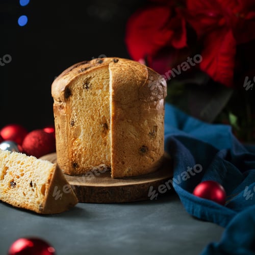 Preview: One panettone sweet bread , traditional Italian food for Christmas on a dark background, close up