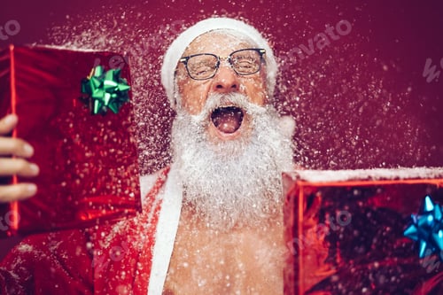 Preview: Happy crazy santa claus holding christmas box gifts