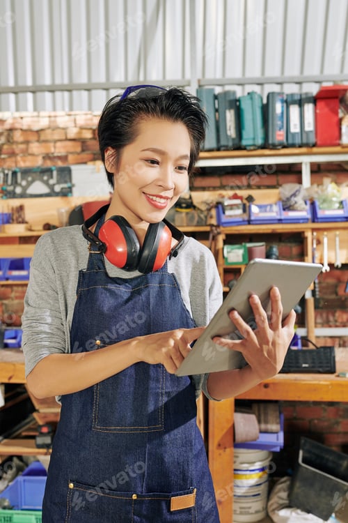 Preview: Carpenter checking dimensions on tablet