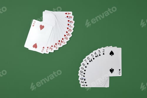 Preview: Deck of playing cards on green background. Cards of hearts and spades are laid out in a fan.