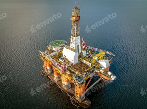 Preview: Sunset View of an Oil and Gas Rig and Platform at Sea