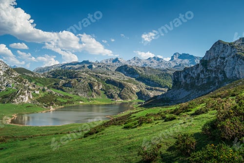 Preview: Scenic view of Covadonga Lakes in Asturias, Spain against a cloudy blue sky