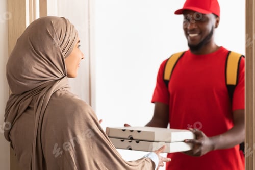 Preview: Black delivery man holding and giving pizza boxes