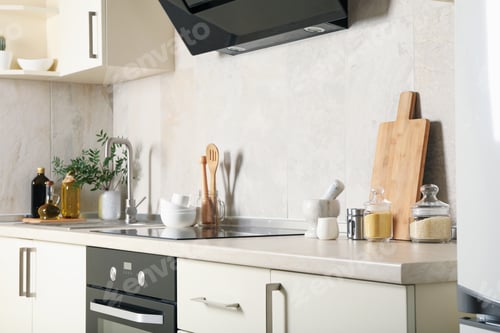 Preview: Modern kitchen interior with different supplies in light colors