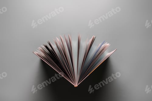 Preview: a directly above view of the opened book on pastel background, spreaded pages