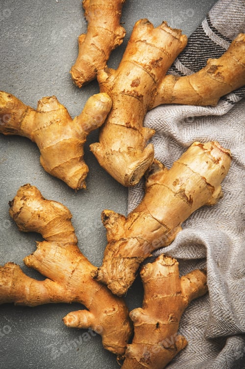 Preview: Fresh ginger root. Gray kitchen table background, top view