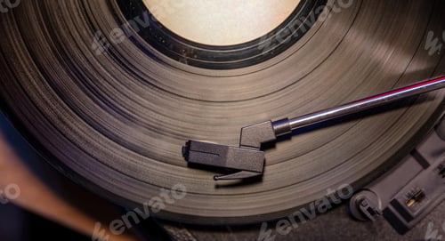 Preview: Turntable vinyl record player. Needle on the disc, close up top view.