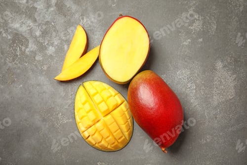 Preview: Flat lay composition with ripe mangoes on grey background