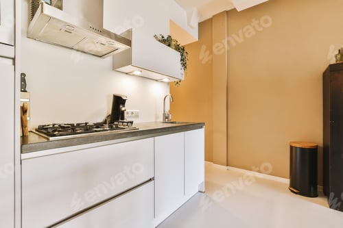 Preview: a kitchen with white cabinets and a stove and sink