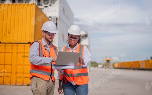 Preview: Engineers railway survey wearing safety uniform and helmet under conversation document on hand inspe