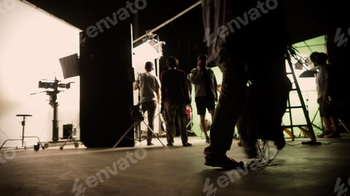 Preview: Blurry images of film crew working and filming in video production studio