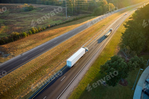 Preview: Aerial view of busy american freeway with fast moving cars and trucks