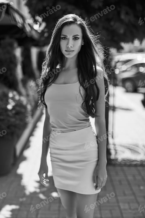 Preview: Portrait Of A Cute And Gorgeous Latin Women In Fashion Dress Posing And Smiling Along Bright
