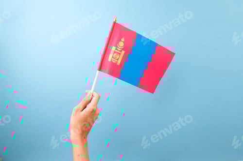 Preview: Hand Holding Mongolia Flag Against Blue Background