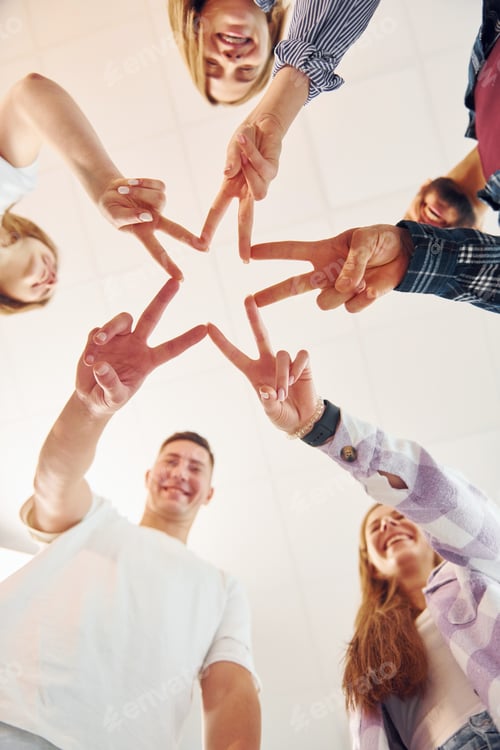Preview: Making gesture by hands. Group of friends standing together
