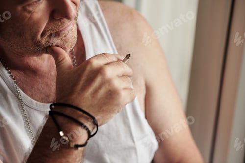 Preview: Pensive Man Smoking Cigarette