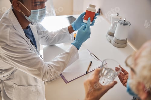 Preview: Geriatrician demonstrating a dietary supplement to a senior man