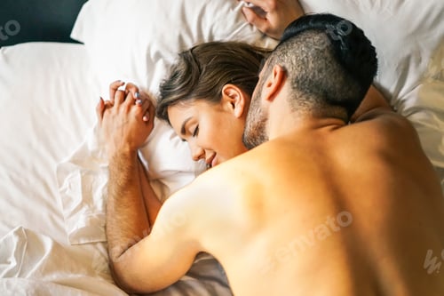 Preview: Passionate young couple having sex on the bed at home