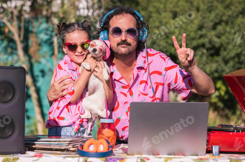 Preview: Dj playing music at a summer party with his daughter and dog
