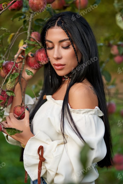 Preview: Pensive beauty posing in garden with closed eyes.
